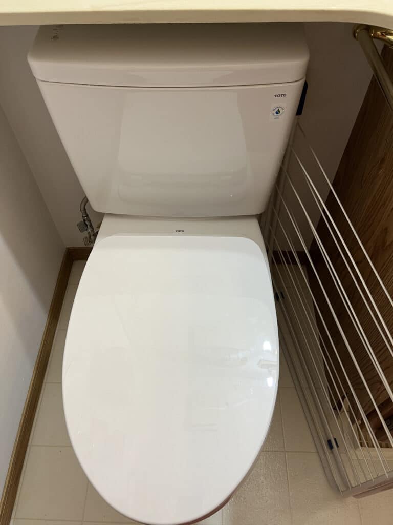 A new and clean toilet after being installed