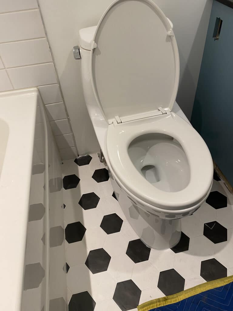 A clean toilet with the seat up